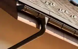 Detailed view of house roof and guttering system. Conifer Gutter Services provides reliable gutter installation and maintenance for your home.