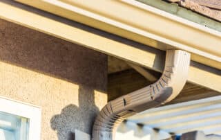 House gutter and downspout in sunlight